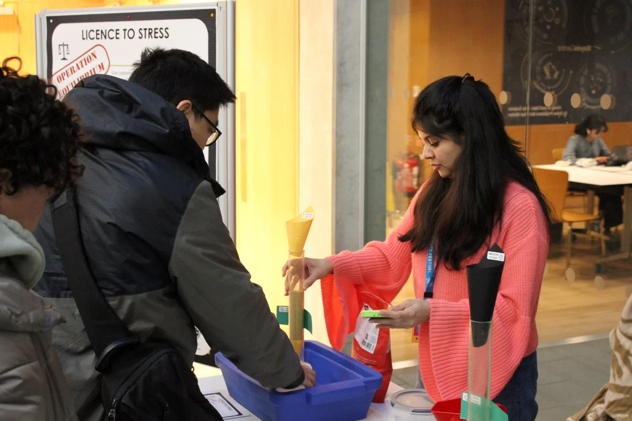 Mahnoor Asif leading a hands-on science activity